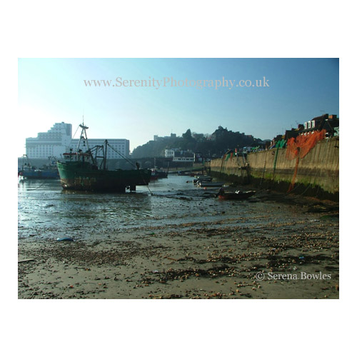 Boats left on the sand at low tide. Folkestone, England.